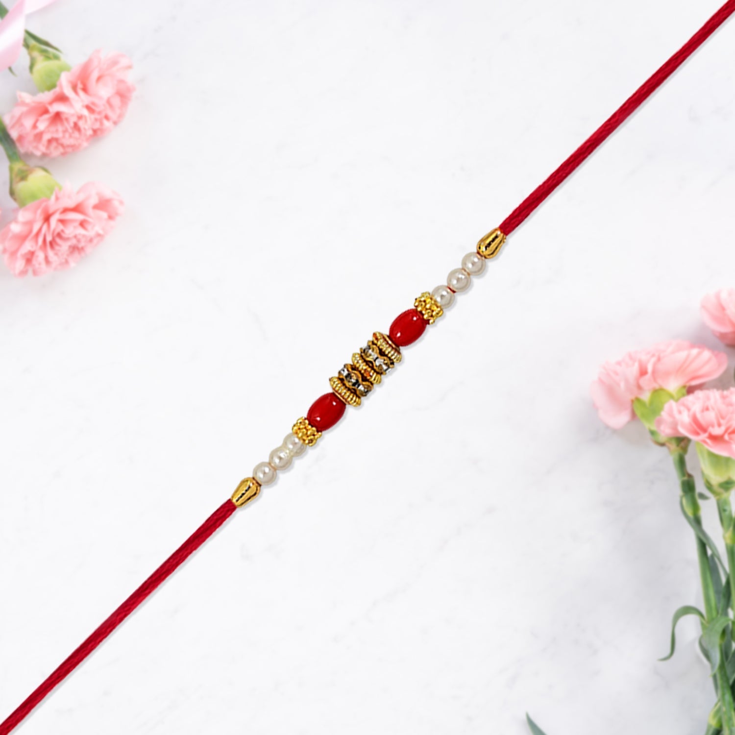 ALVENZA Pearl Beaded Rakhi – Traditional Red & Gold Elegance