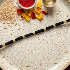 Rakhi Handmade Black Thread with Gold Beads for Raksha Bandhan - Front View