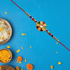 ALVENZA Multicolor Kundan Rakhi - Golden Floral Design with Beaded Red Thread