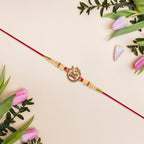 ALVENZA Om Swastik Rakhi - Golden Motif with Pearl Beads for Brother