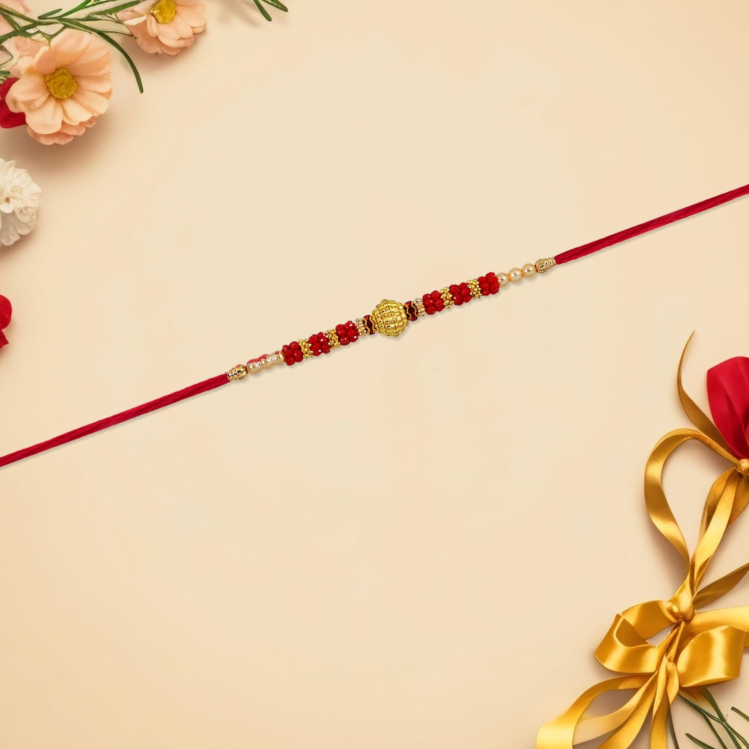 ALVENZA Red Bead Rakhi – Golden Centerpiece & Pearl Details
