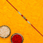 ALVENZA Pearl Beaded Rakhi – Traditional Red & Gold Elegance