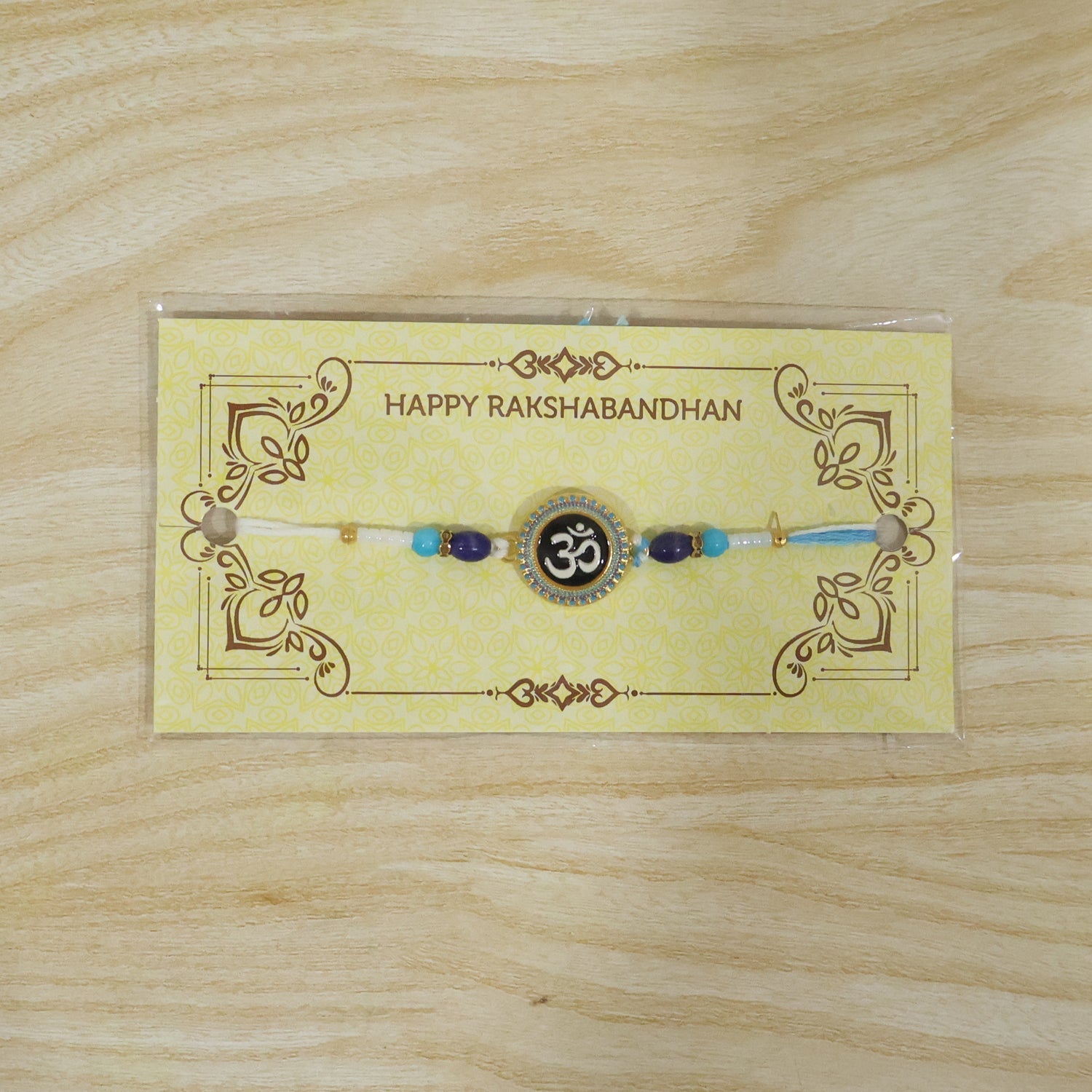 ALVENZA Om Symbol Rakhi – Elegant Beaded Design for Raksha Bandhan