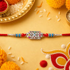 ALVENZA Rectangular Pearl Crystal Rakhi with Red Blue Beads, Roli Chawal Coin and Gift Packing