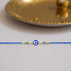 ALVENZA Blue Rakhi – Elegant Stone & Pearl Design for Brother