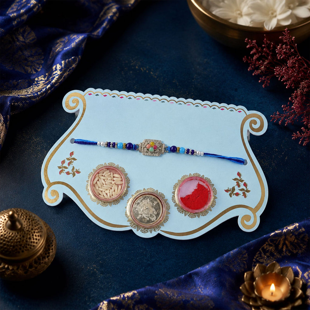 ALVENZA Silver Floral Stone Rakhi with Royal Blue Thread, Roli Chawal Coin and Card Gift Packing