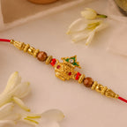 ALVENZA Golden Kalash Rakhi - Elegant Moti Design for Brother