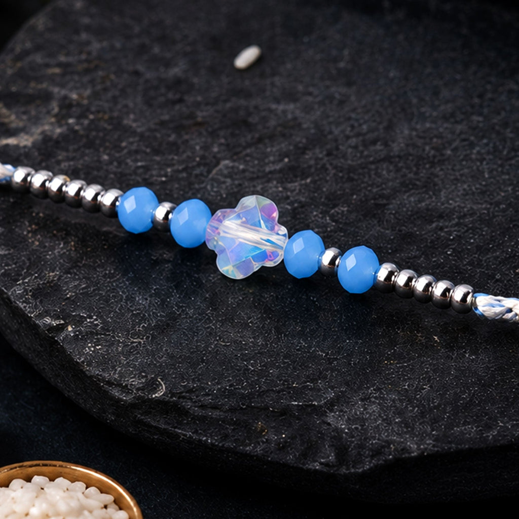 ALVENZA Blue Crystal Bead Rakhi with Round Stone Centre, Silver Highlights and Red Thread