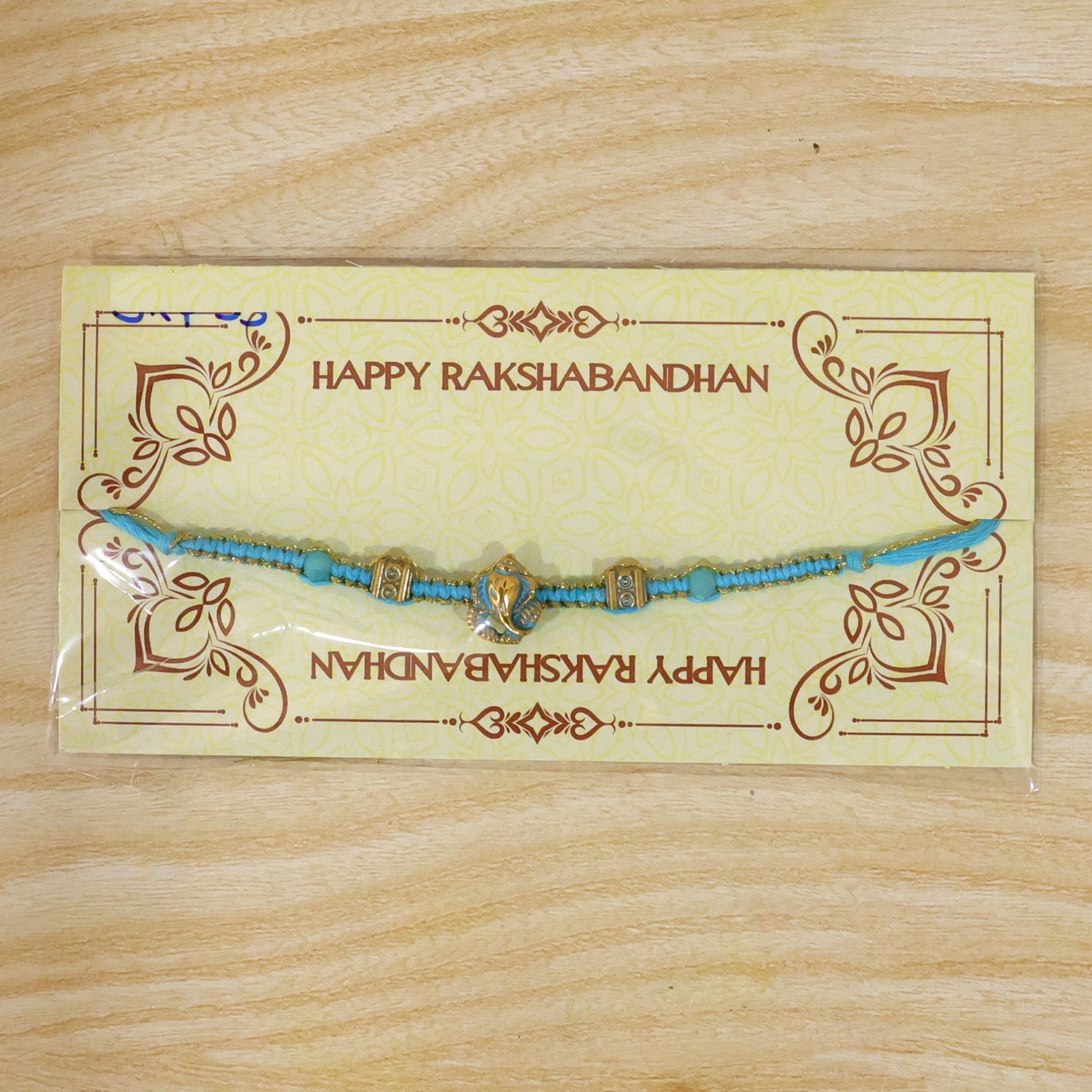 ALVENZA Turquoise Center Designer Rakhi with Gold Tone Detail and Elegant Bracelet Beauty