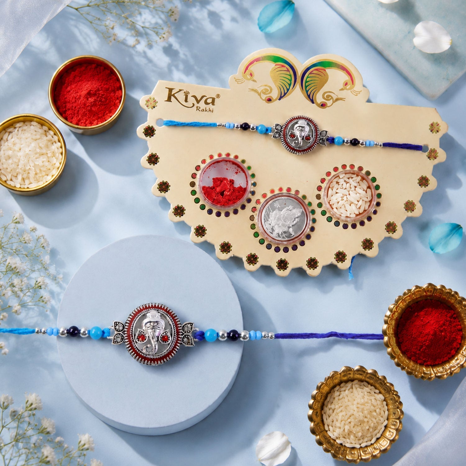 ALVENZA Round Ganesha Medallion Rakhi with Blue Thread, Roli Chawal Coin and Peacock Card Packing