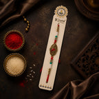 ALVENZA Antique Gold Oval Filigree Rakhi with Red Teardrop Stone, Pearl & Multicolor Beads