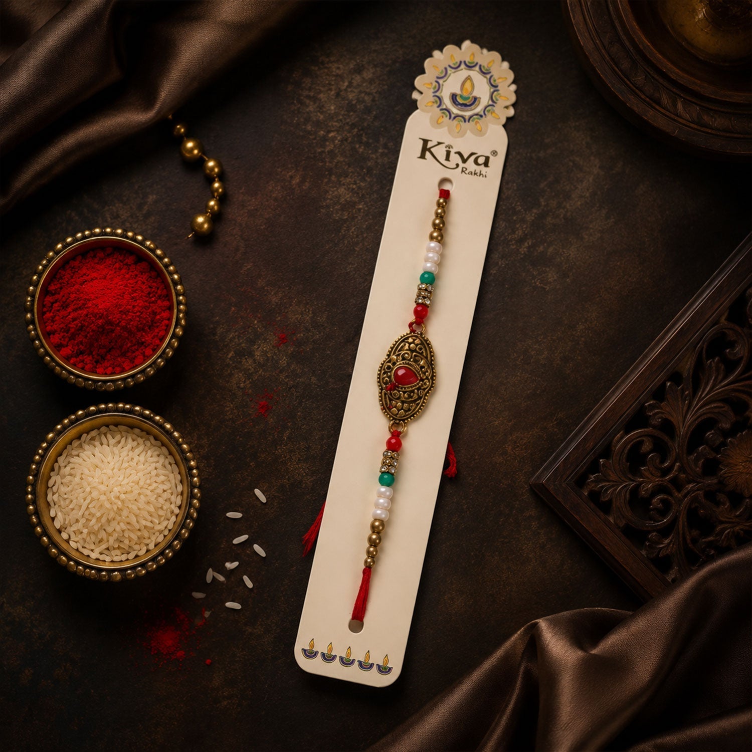 ALVENZA Antique Gold Oval Filigree Rakhi with Red Teardrop Stone, Pearl & Multicolor Beads