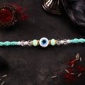 ALVENZA Blue Evil Eye Nazar Charm Rakhi with Turquoise Thread and Bracelet Style Beads