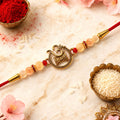 ALVENZA Om Swastik Rakhi - Golden Motif with Pearl Beads for Brother