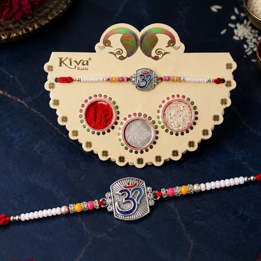 ALVENZA Om Symbol Silver Centre Rakhi with White Beads, Roli Chawal Coin and Peacock Gift Packing