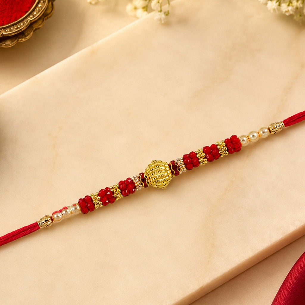ALVENZA Red Bead Rakhi – Golden Centerpiece & Pearl Details