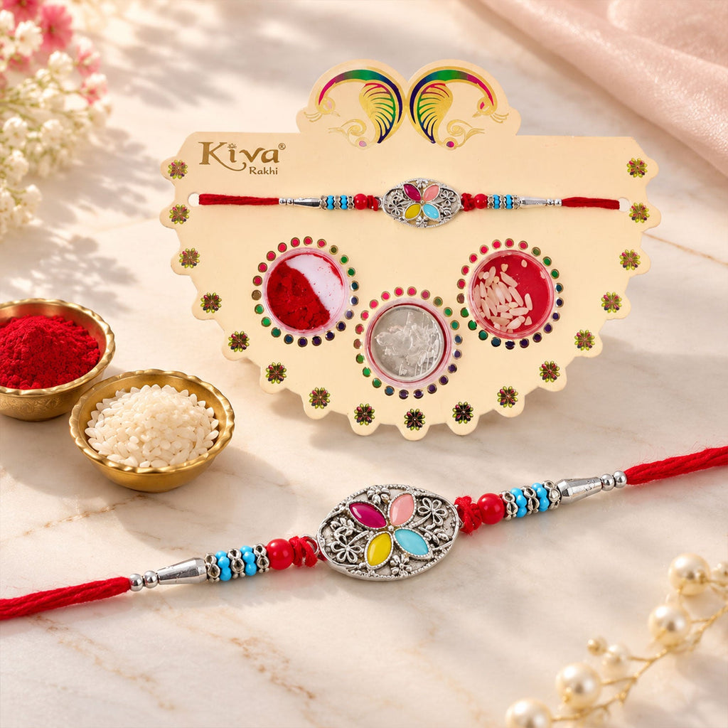 ALVENZA Silver Oval Floral Stone Rakhi with Color Petal Centre, Roli Chawal Coin and Card Packing