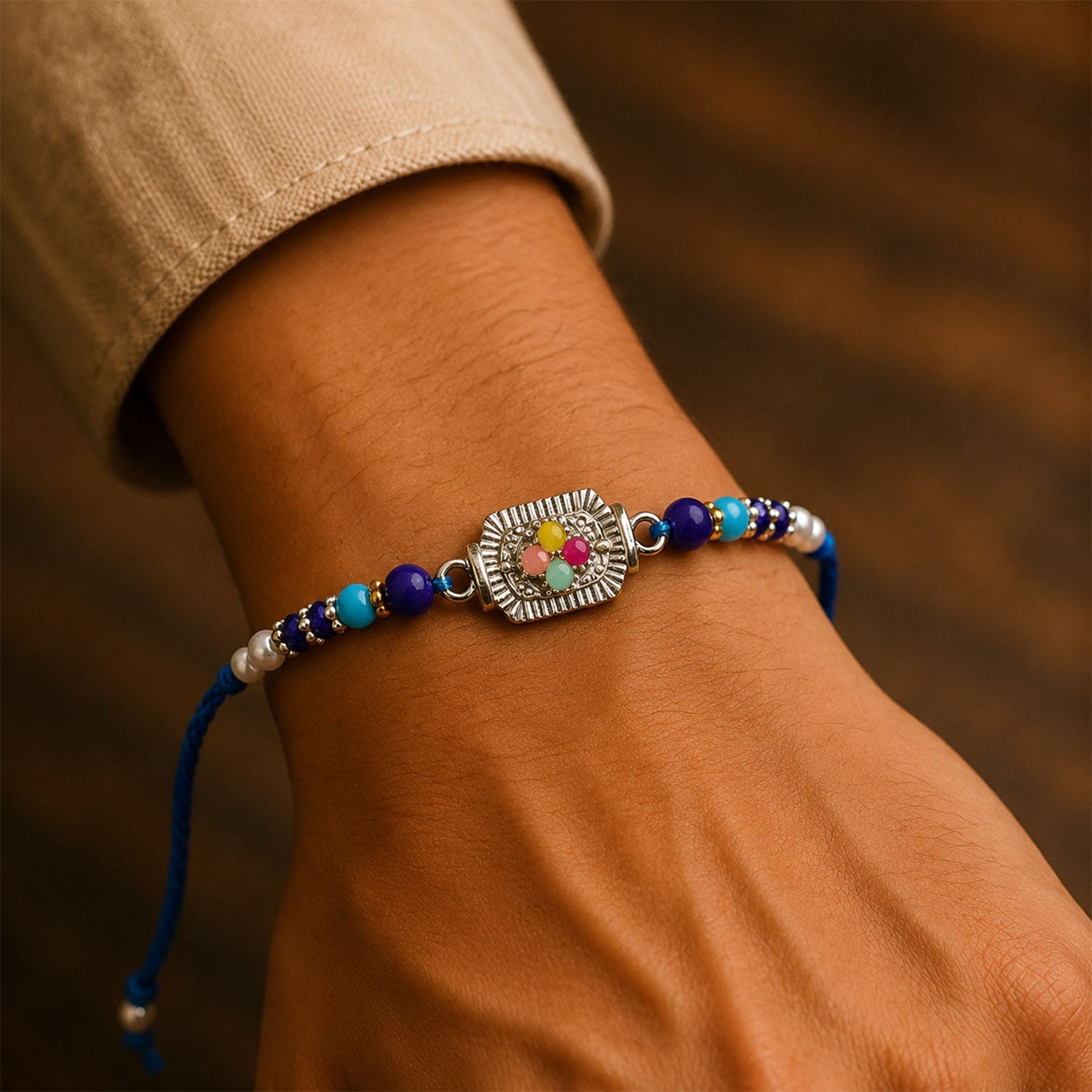 ALVENZA Silver Floral Stone Rakhi with Royal Blue Thread, Roli Chawal Coin and Card Gift Packing