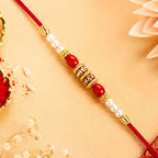 ALVENZA Pearl Beaded Rakhi – Traditional Red & Gold Elegance