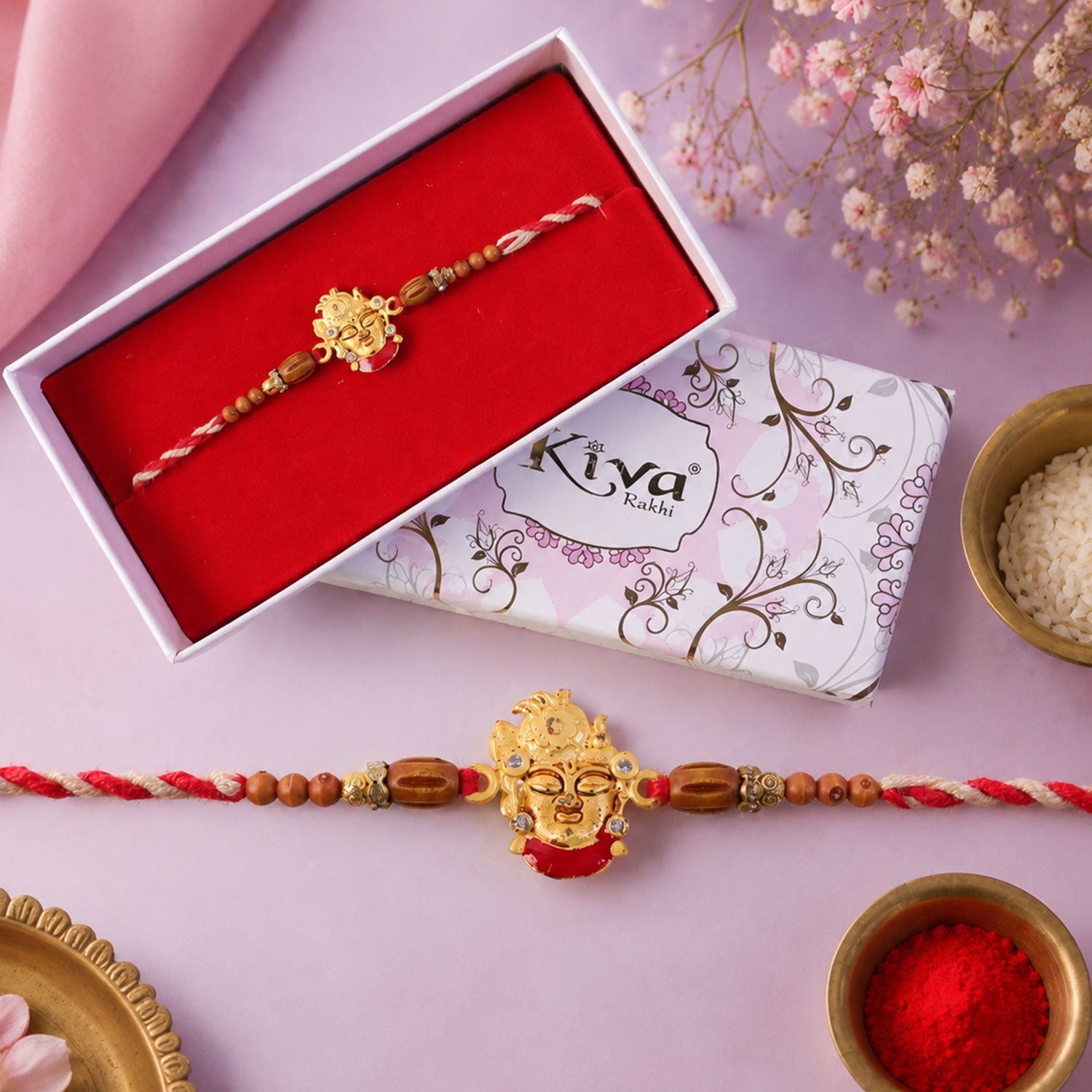 ALVENZA Golden Shrinathji Face Rakhi with Red Enamel Detail, Sandalwood-Finish Beads