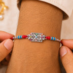 ALVENZA Rectangular Pearl Crystal Rakhi with Red Blue Beads, Roli Chawal Coin and Gift Packing