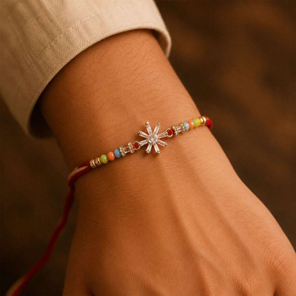 ALVENZA Rose Gold Sunburst Crystal Rakhi with Baguette AD Stones and Rainbow Pastel Beads