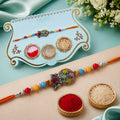ALVENZA Multicolor Teardrop Leaf Rakhi with Orange Thread, Roli Chawal Coin and Gift Box Packing