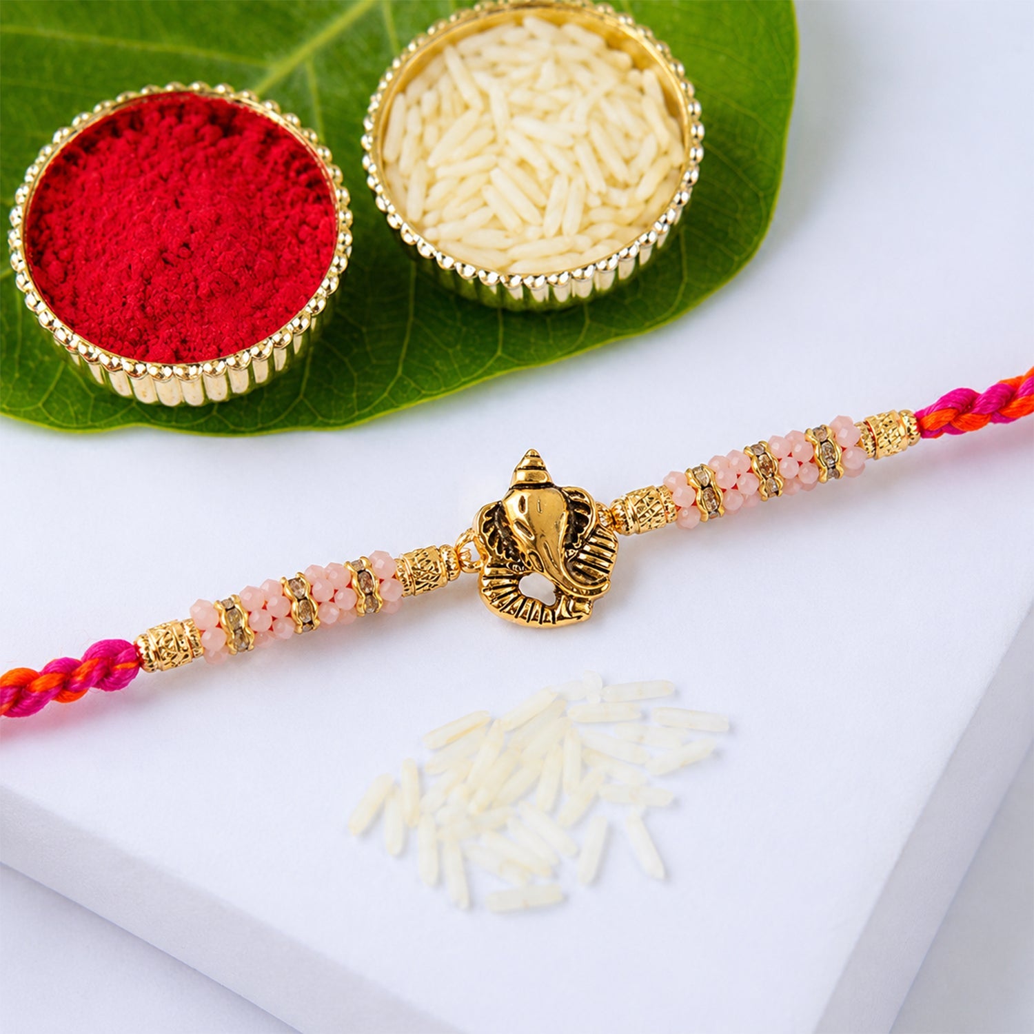 ALVENZA Silver Tone Designer Rakhi with Pastel Beads and Elegant Bracelet Style Finish