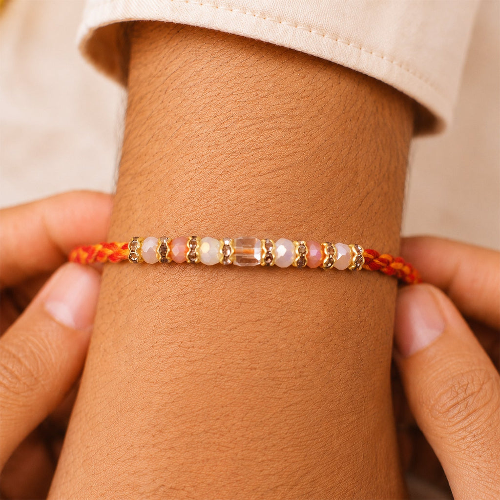 ALVENZA Silver Tone Designer Rakhi with Pastel Beads and Elegant Bracelet Style Finish