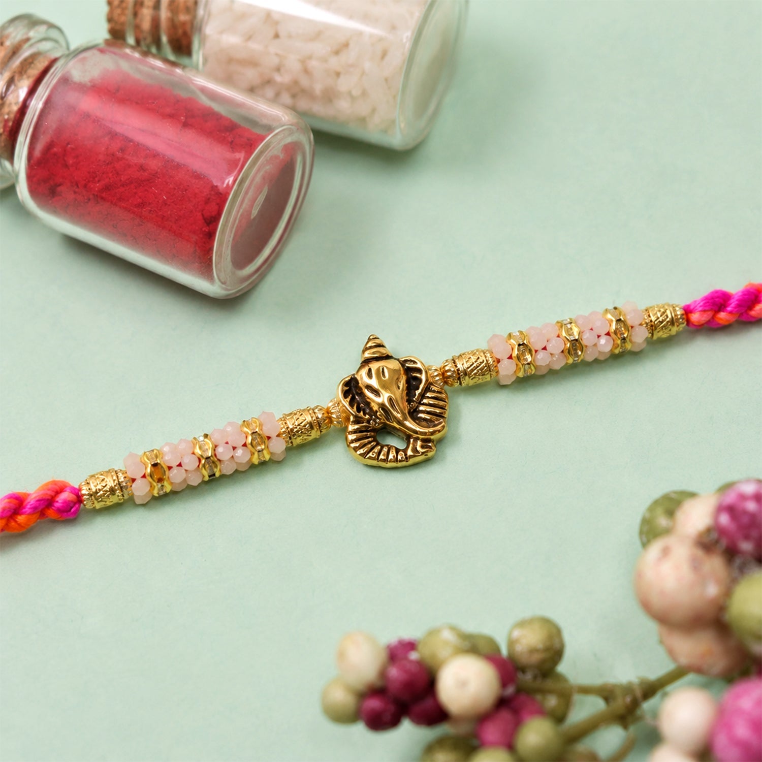 ALVENZA Silver Tone Designer Rakhi with Pastel Beads and Elegant Bracelet Style Finish
