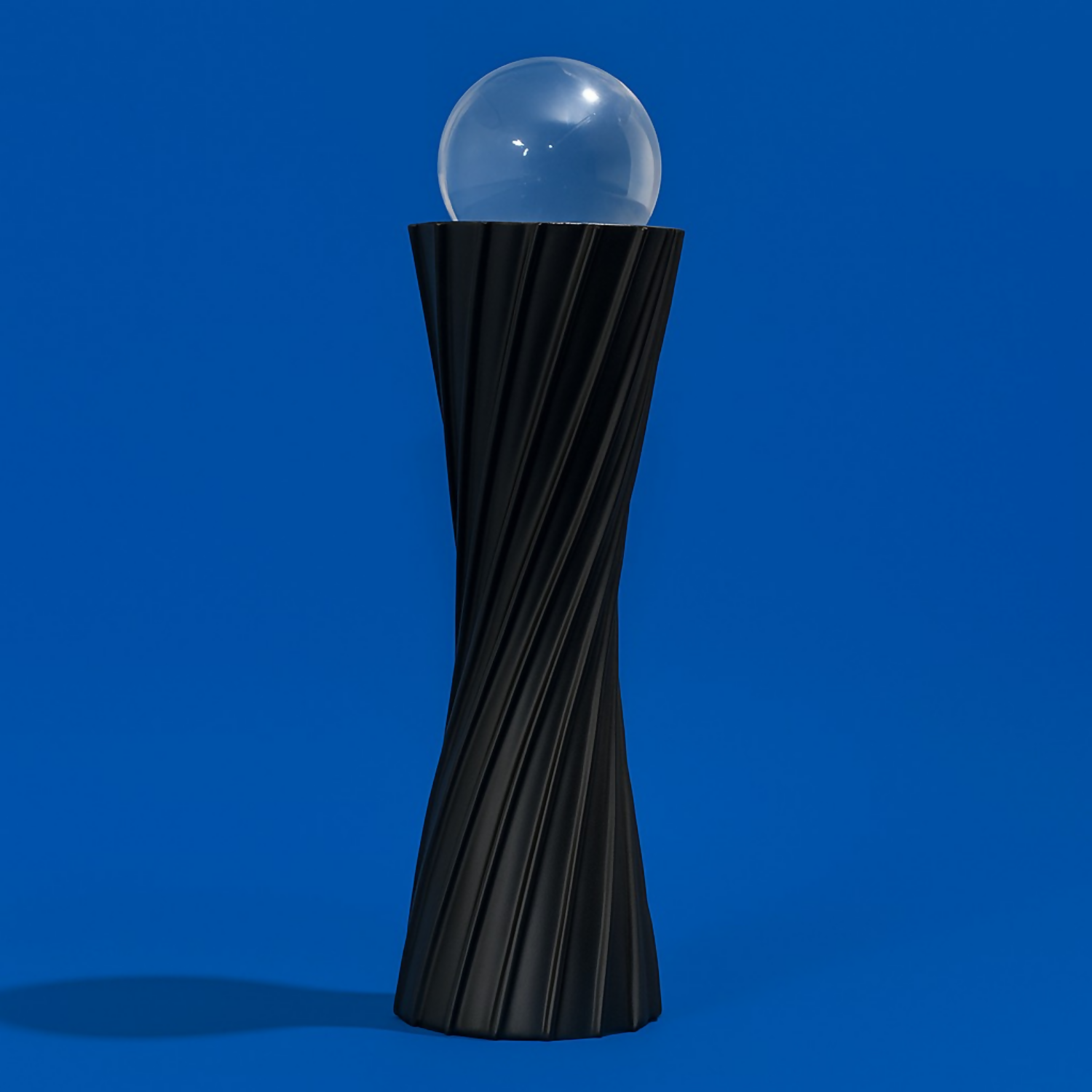 ALVENZA Black Twisted Resin Showpiece with Glass Ball – Modern Elegant Accent