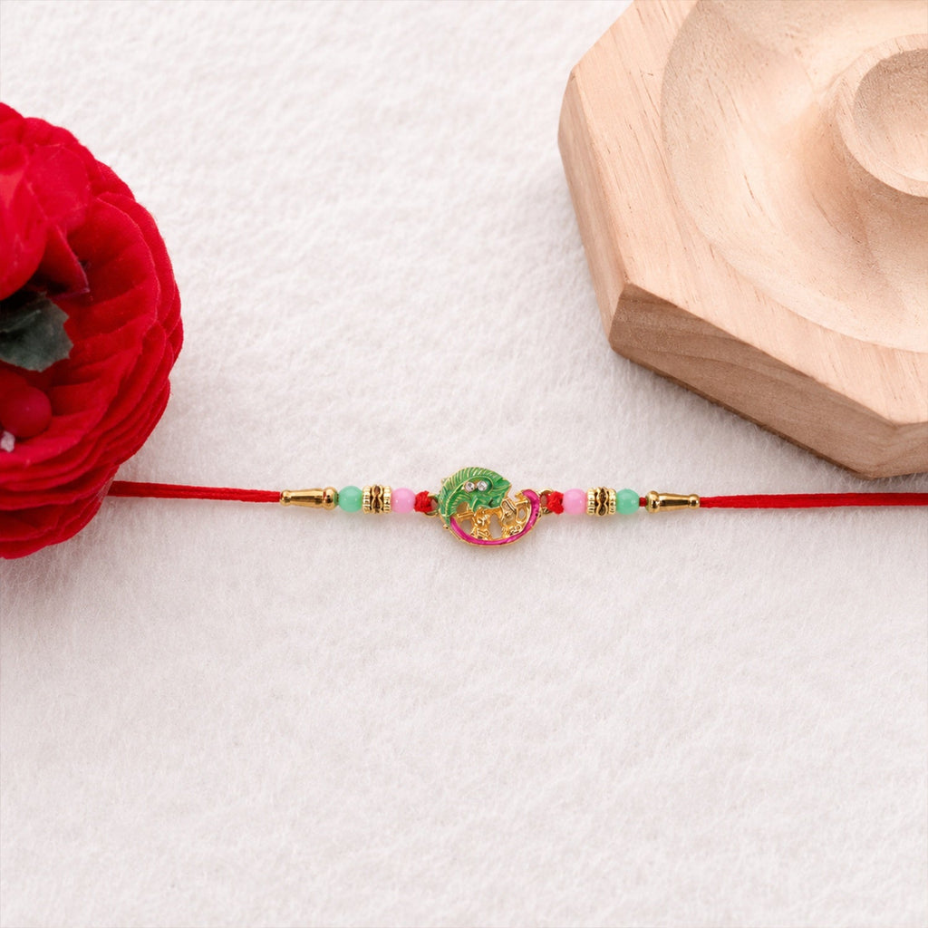 ALVENZA Mini Krishna Peacock Leaf Rakhi – Elegant Traditional Design for Raksha Bandhan