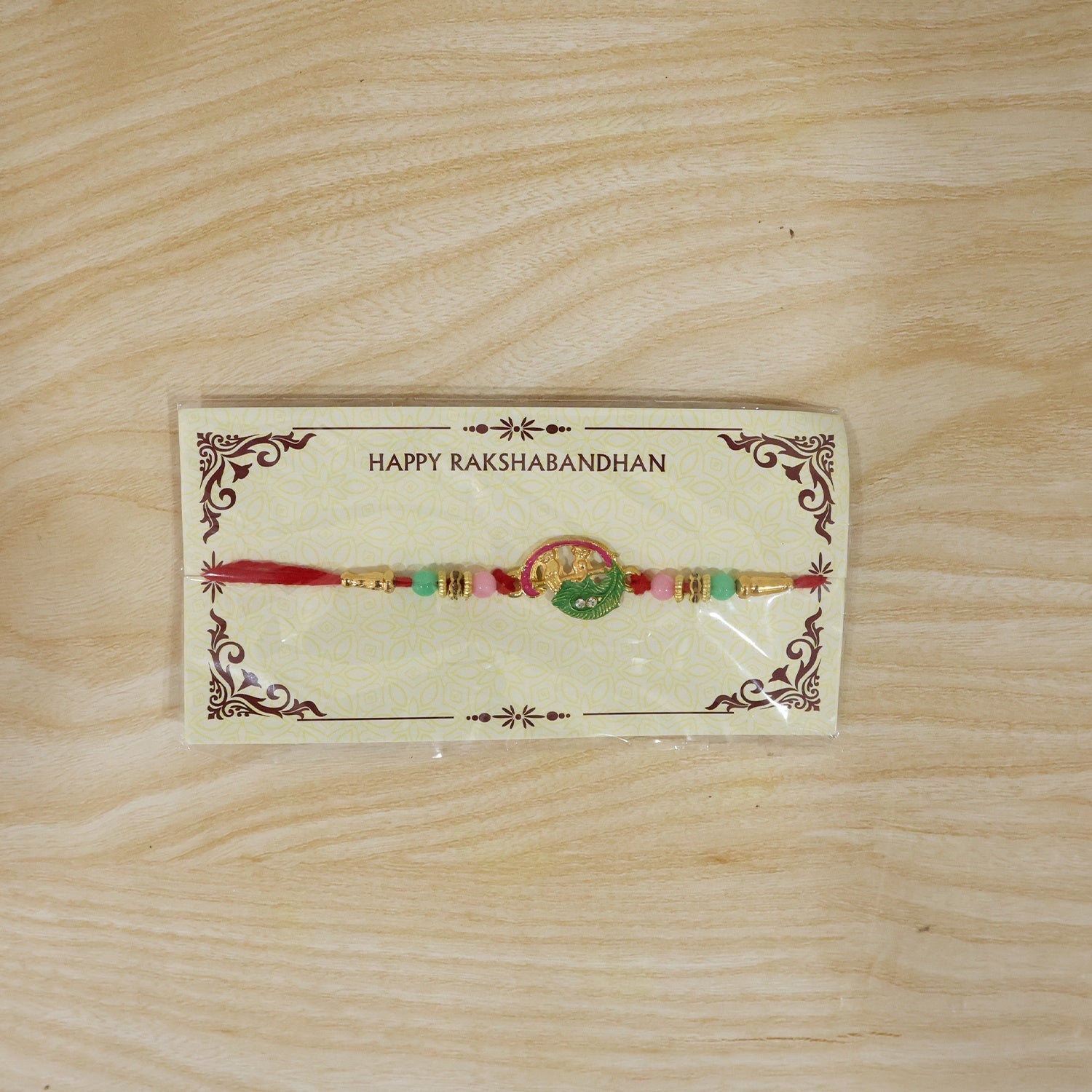 ALVENZA Mini Krishna Peacock Leaf Rakhi – Elegant Traditional Design for Raksha Bandhan