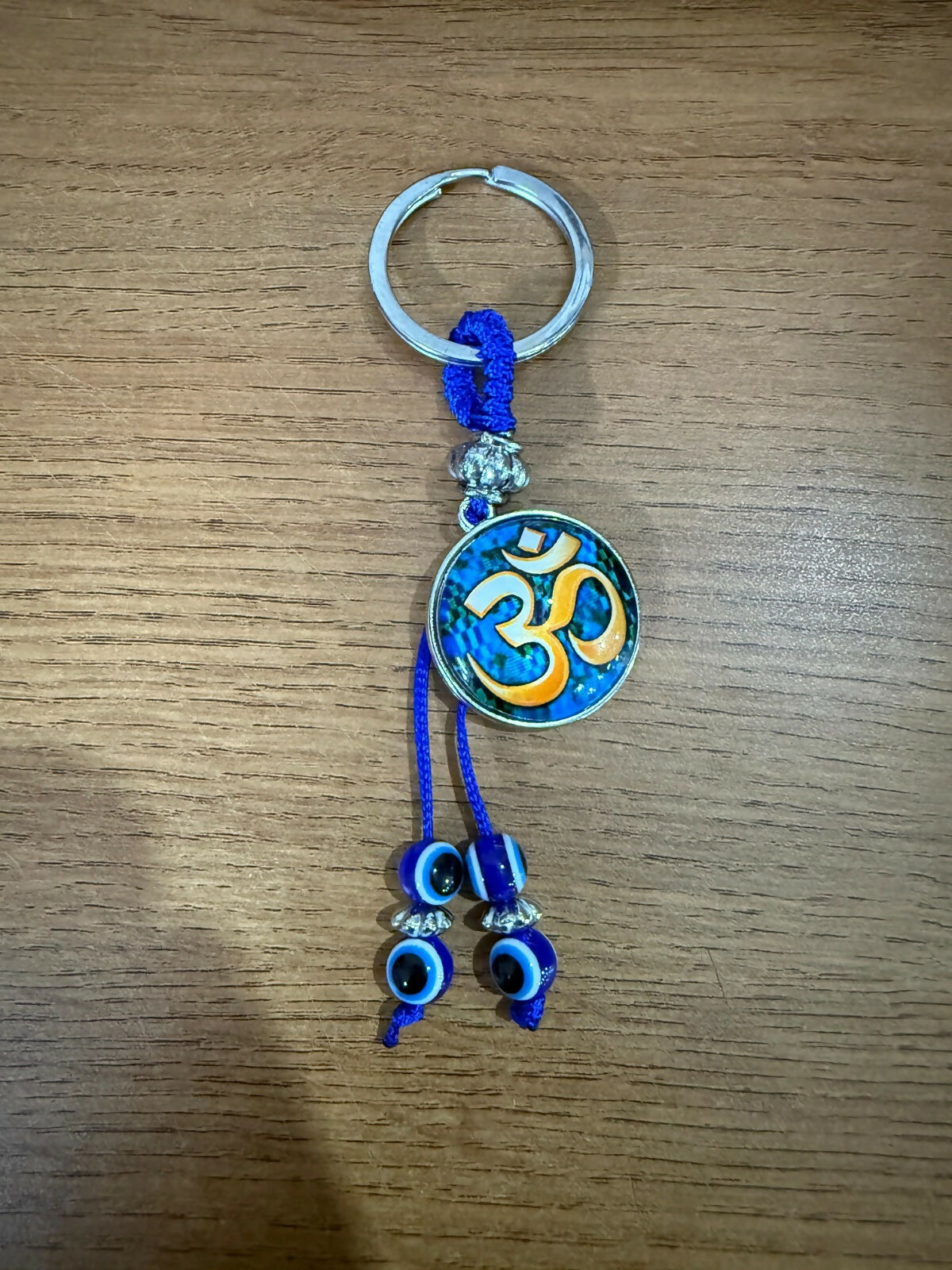 ALVENZA Om Evil Eye Keychain – Spiritual Protection with Blue Beads