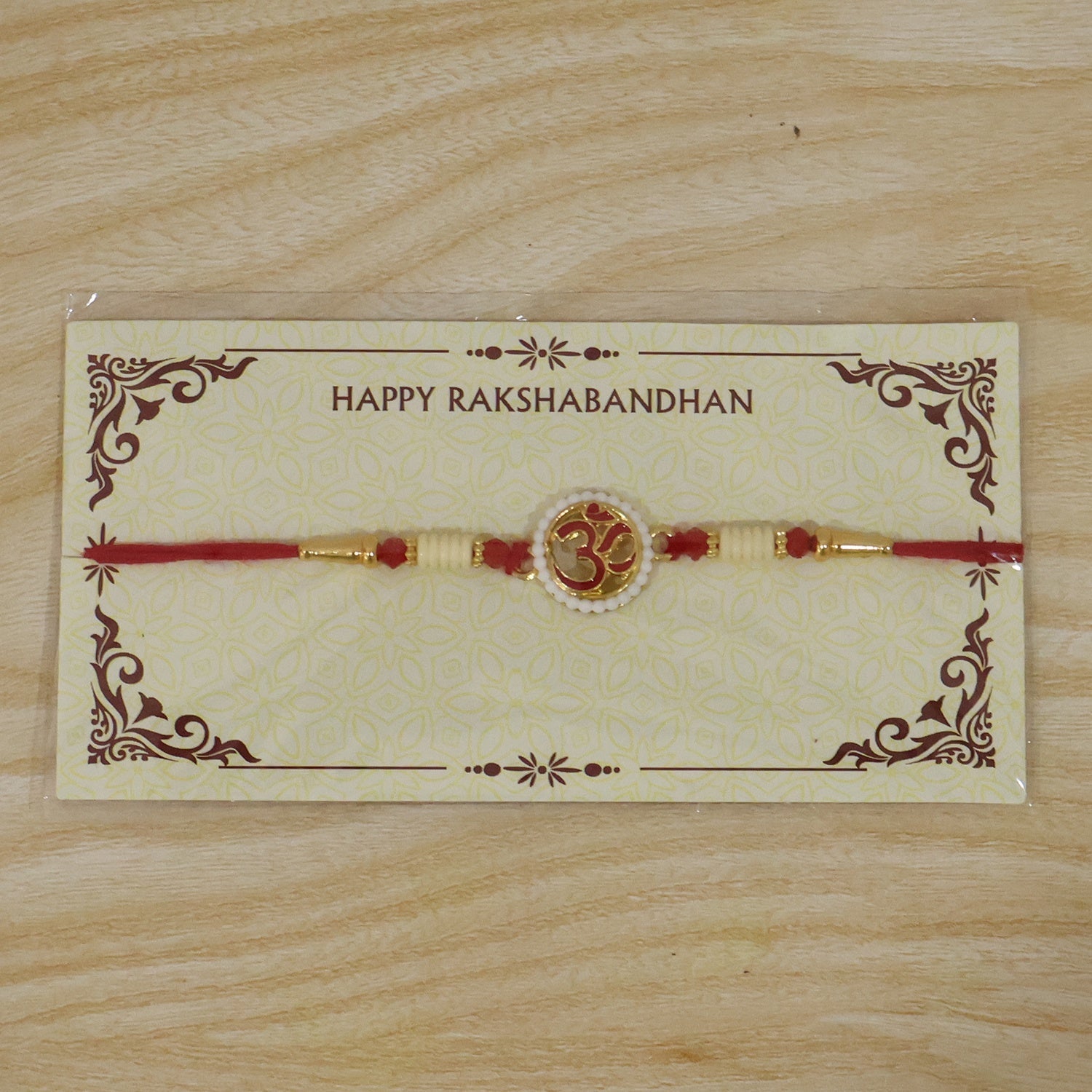 ALVENZA OM Symbol Pearl Frame Rakhi – Elegant Traditional Design for Raksha Bandhan