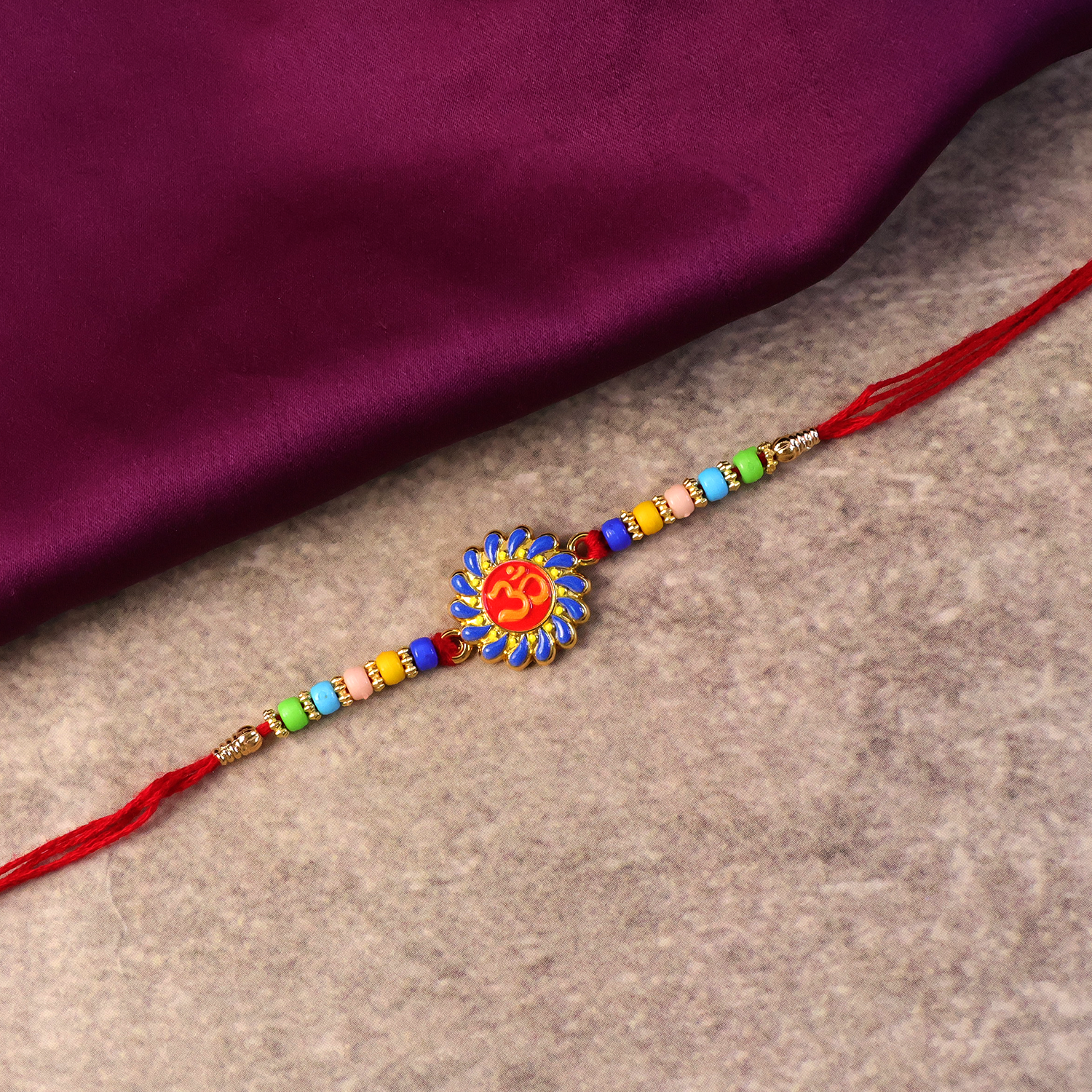 ALVENZA OM Symbol Rakhi – Traditional Beads & Red Thread for Brothers
