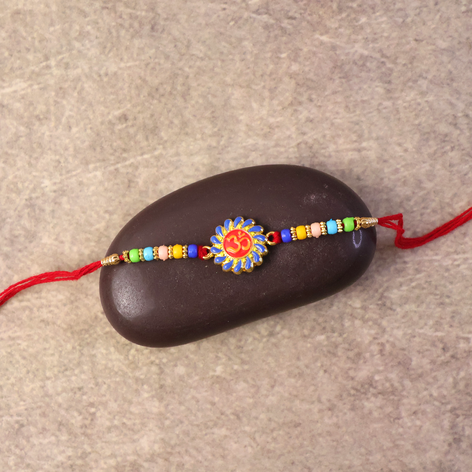 ALVENZA OM Symbol Rakhi – Traditional Beads & Red Thread for Brothers