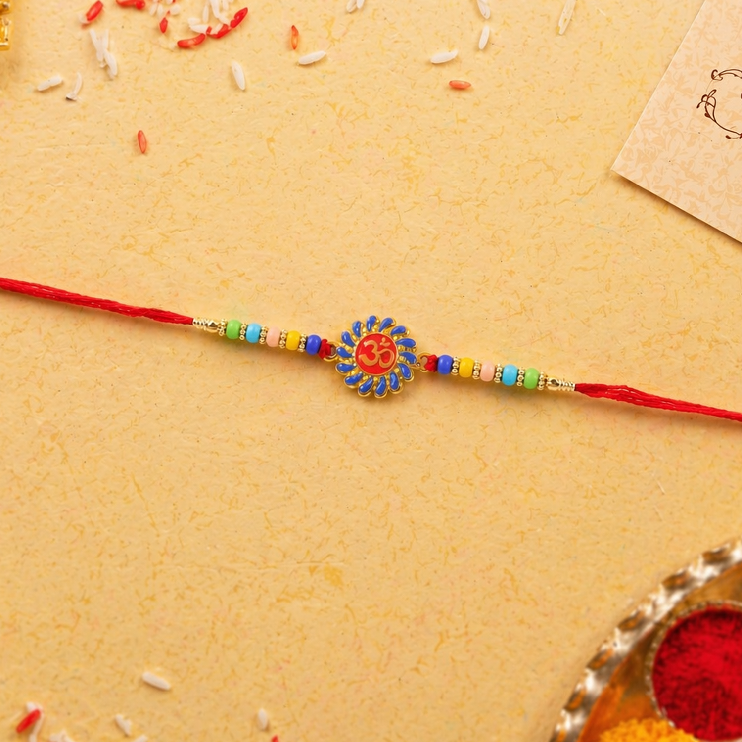 ALVENZA OM Symbol Rakhi – Traditional Beads & Red Thread for Brothers