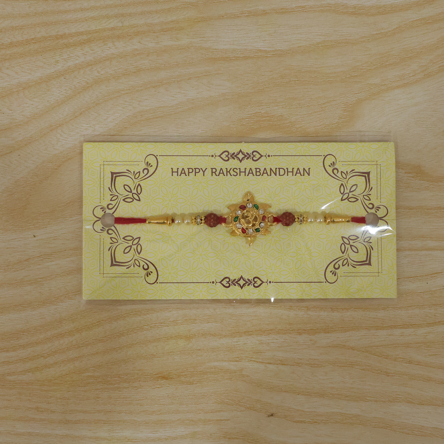ALVENZA Divine Om Symbol Rakhi – Elegant Stones & Spiritual Design