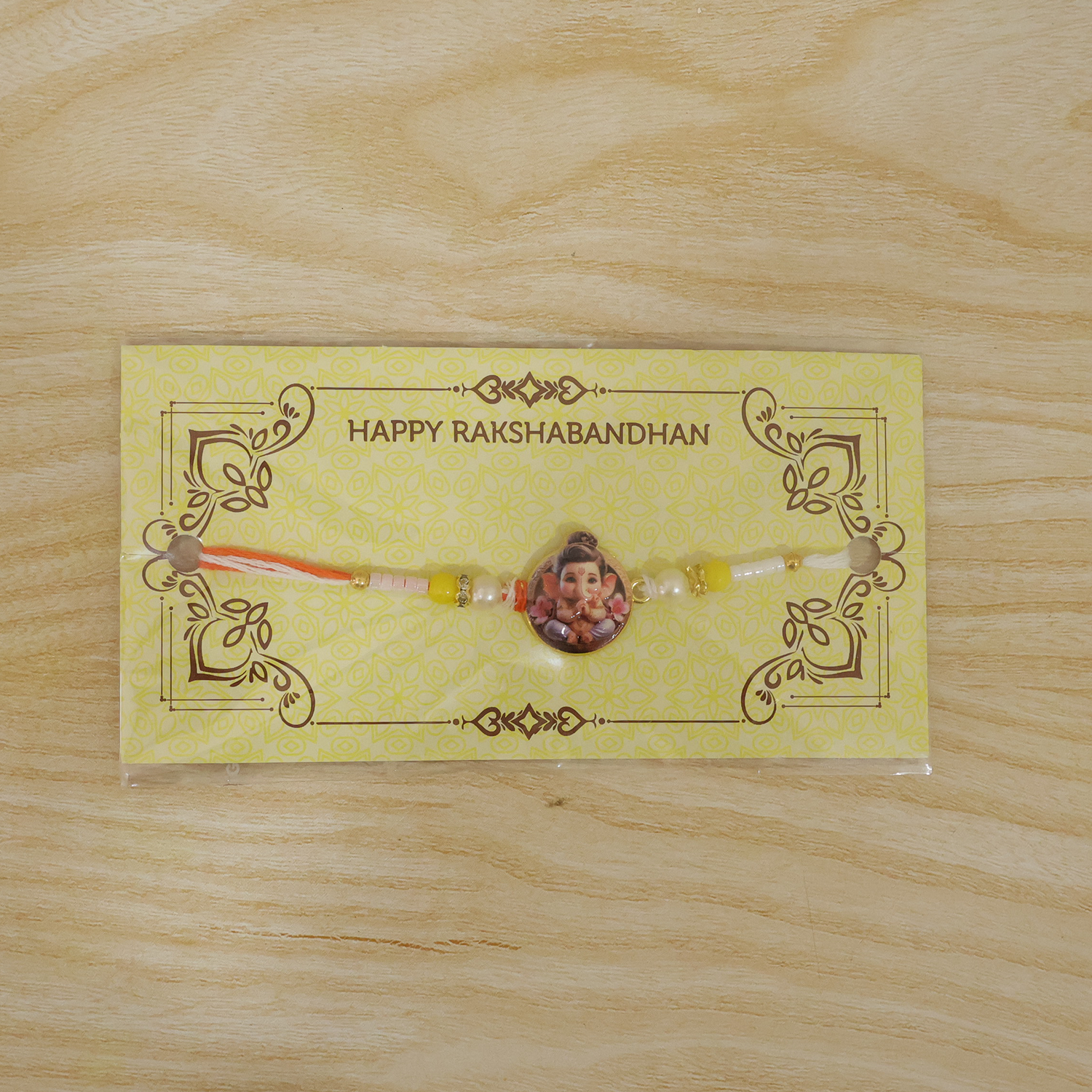 ALVENZA Ganesh Ji Rakhi – Vibrant Yellow Beads with Soft Thread for Raksha Bandhan