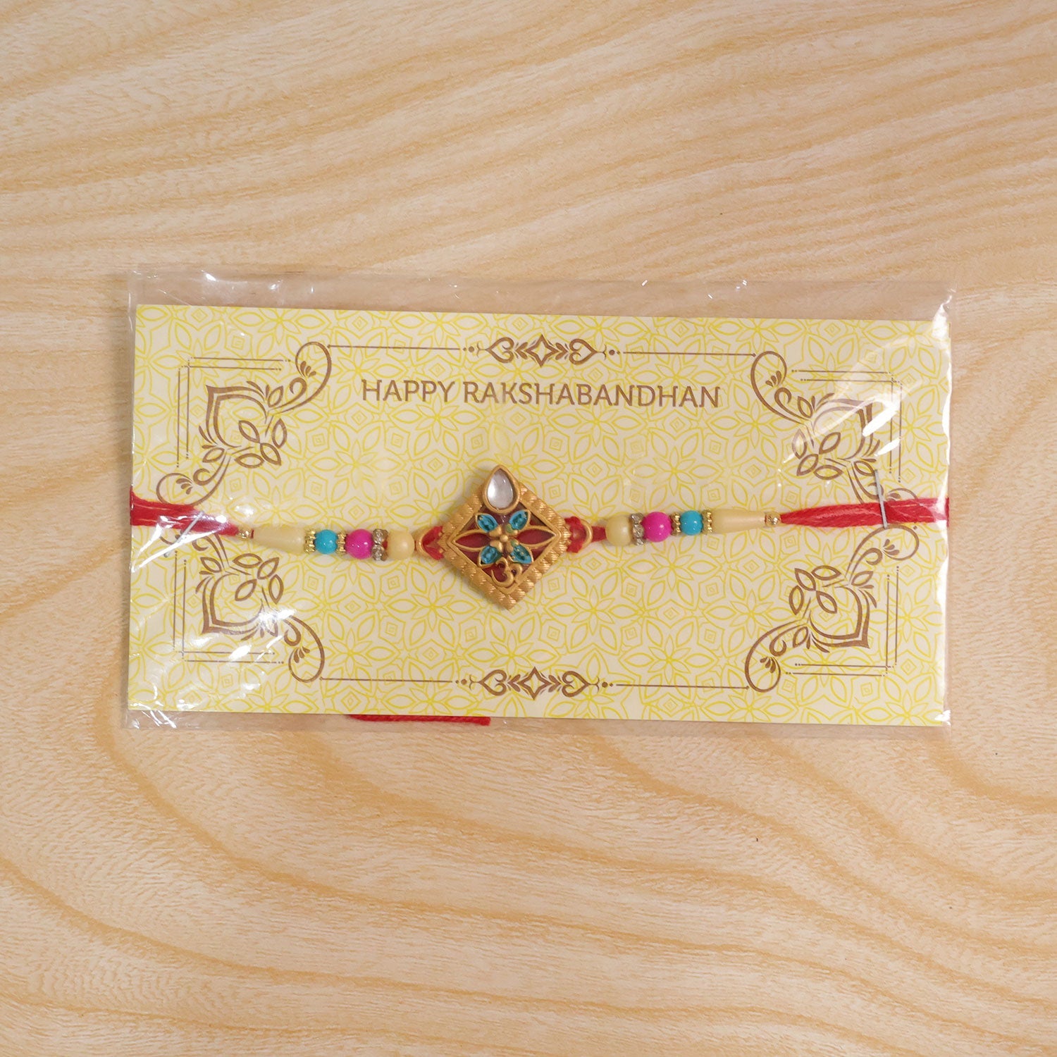 ALVENZA Diamond Shape Rakhi with Stone Embellishments and Beads