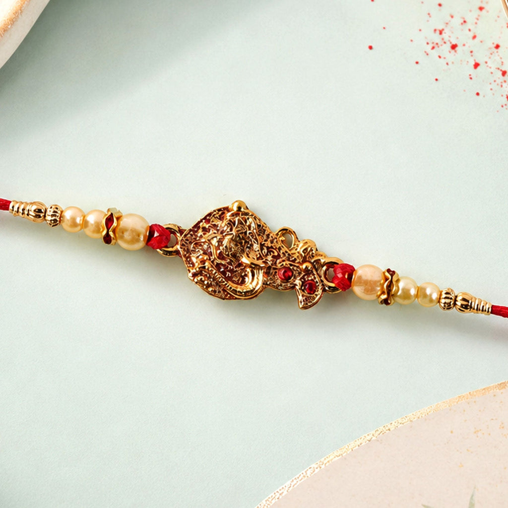 ALVENZA Golden Peacock Rakhi - Pearl Beads & Red Thread for Brother on Raksha Bandhan