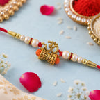 ALVENZA Golden Charm Rakhi - Pearl Beads, Red Thread for Brother