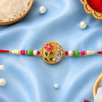 ALVENZA Flower Design Rakhi with Red and Green Beads - Festive Elegance
