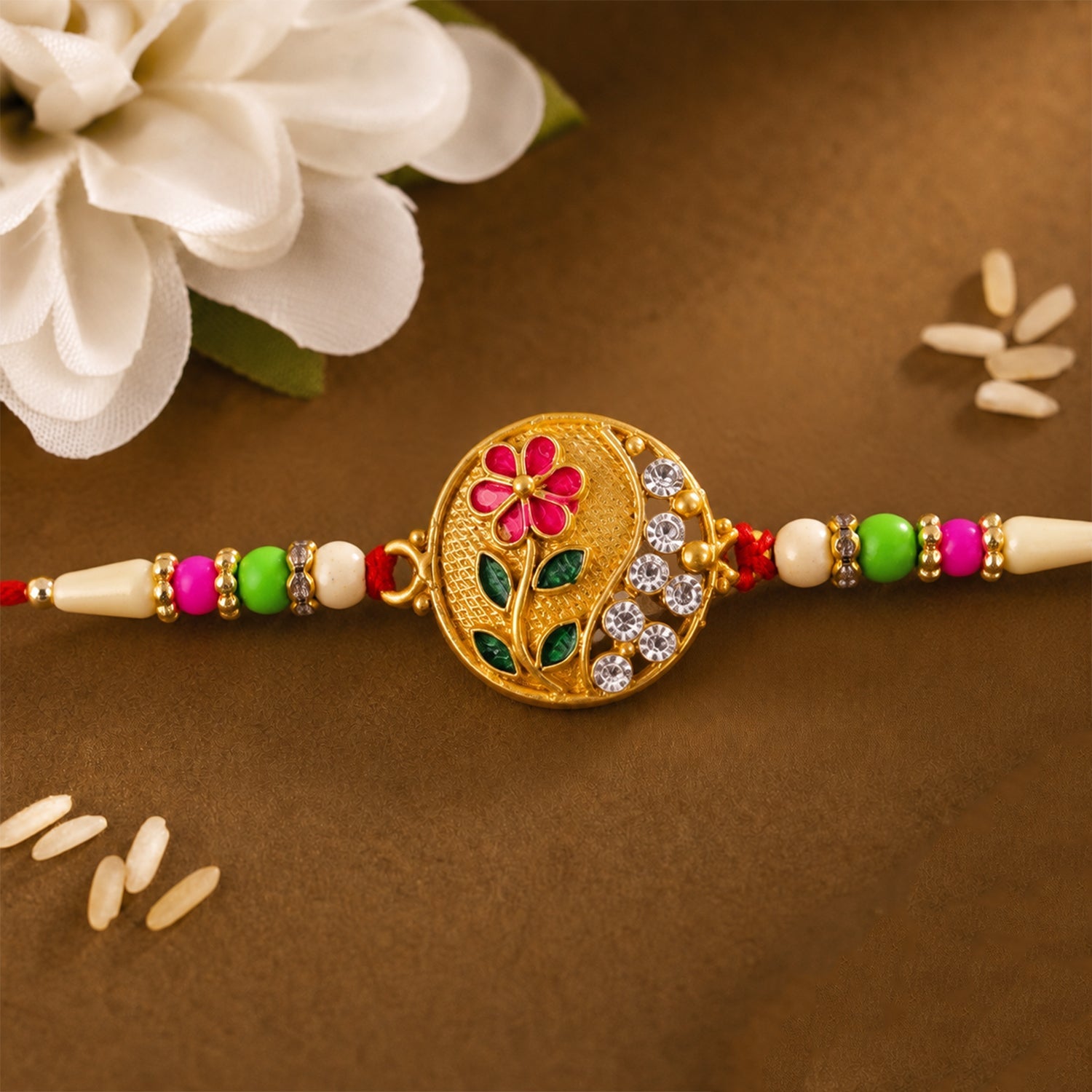 ALVENZA Flower Design Rakhi with Red and Green Beads - Festive Elegance