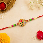 ALVENZA Flower Design Rakhi with Red and Green Beads - Festive Elegance