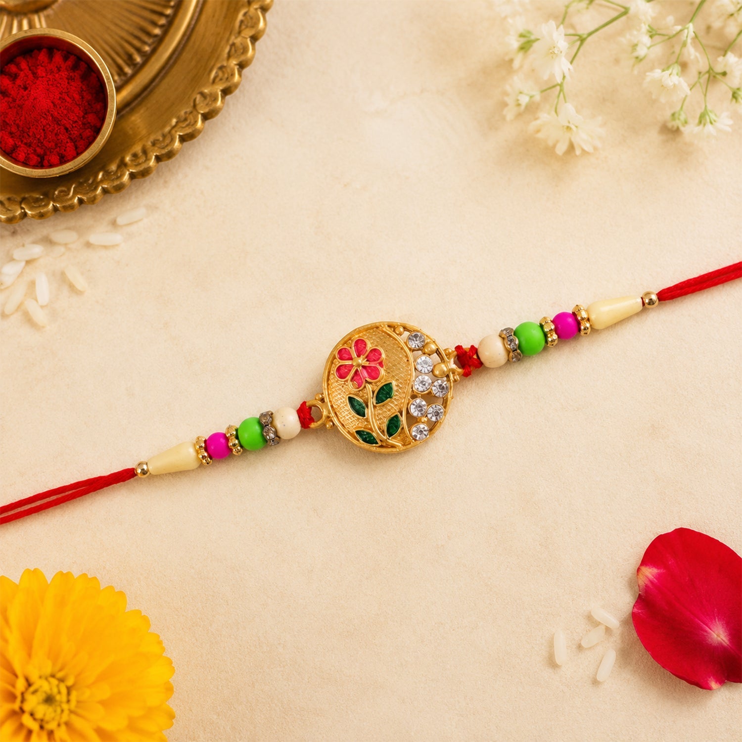 ALVENZA Flower Design Rakhi with Red and Green Beads - Festive Elegance