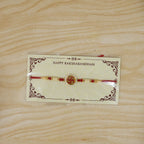 ALVENZA Swastik Pearl Frame Rakhi – Elegant and Traditional Tie for Brothers