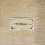 ALVENZA Krishna Naam Devnagari Peacock Feather Rakhi – Traditional Brother Gift