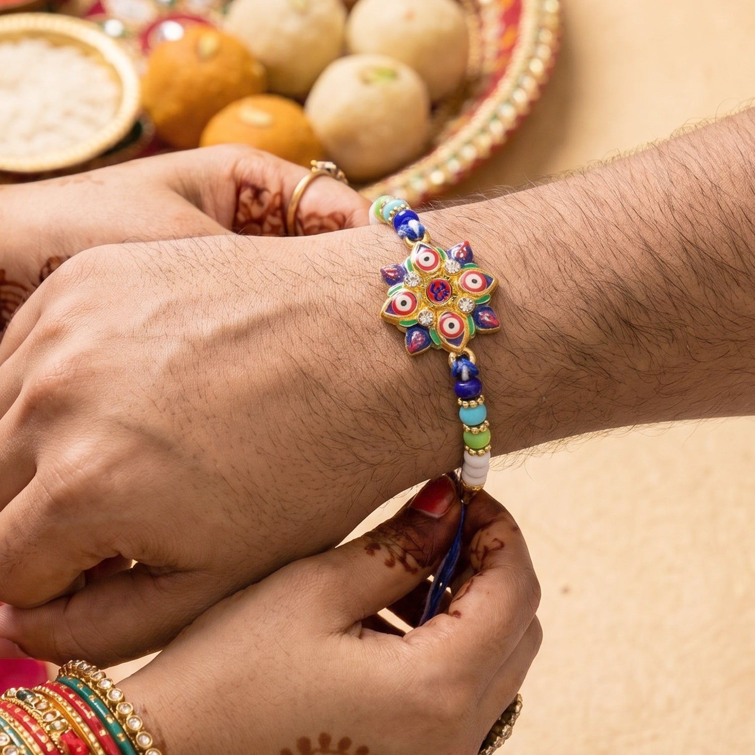ALVENZA Evil Eye OM Star Rakhi – Symbols of Protection & Tradition